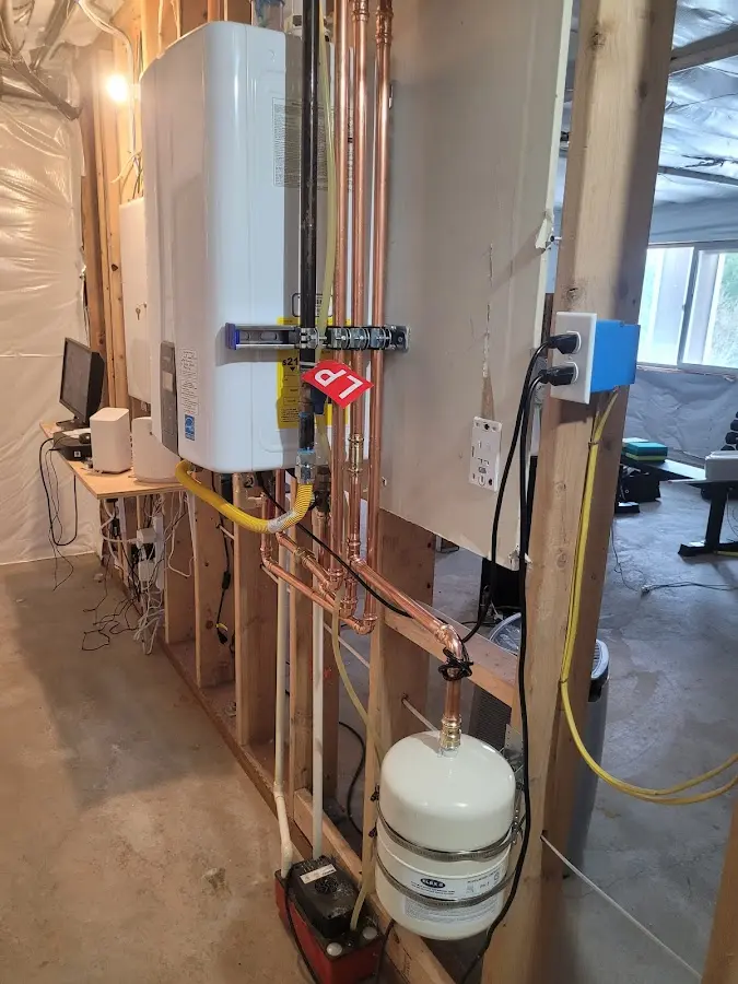 Licensed plumber repairing a kitchen sink in Kingston
